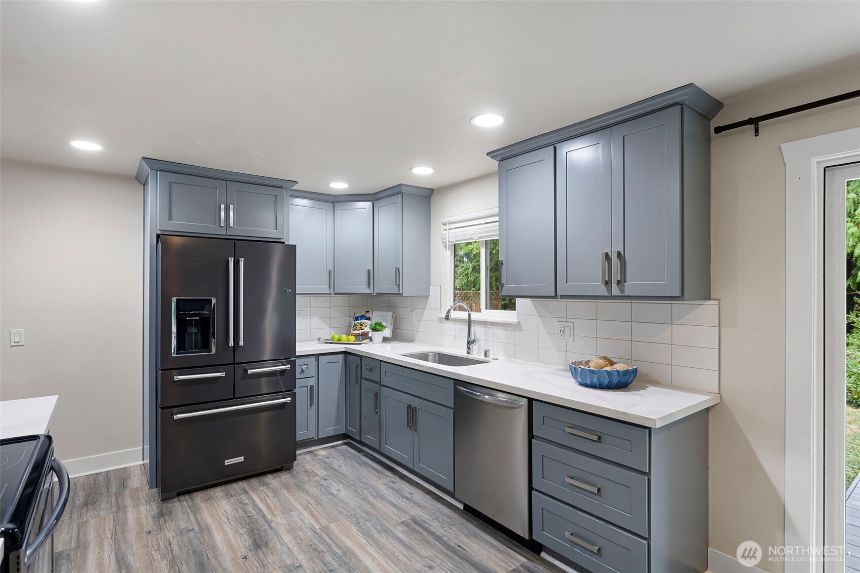 11705 Silver Way Everett, WA 98208 - Photo 8 of 26 a kitchen with a refrigerator sink and cabinets