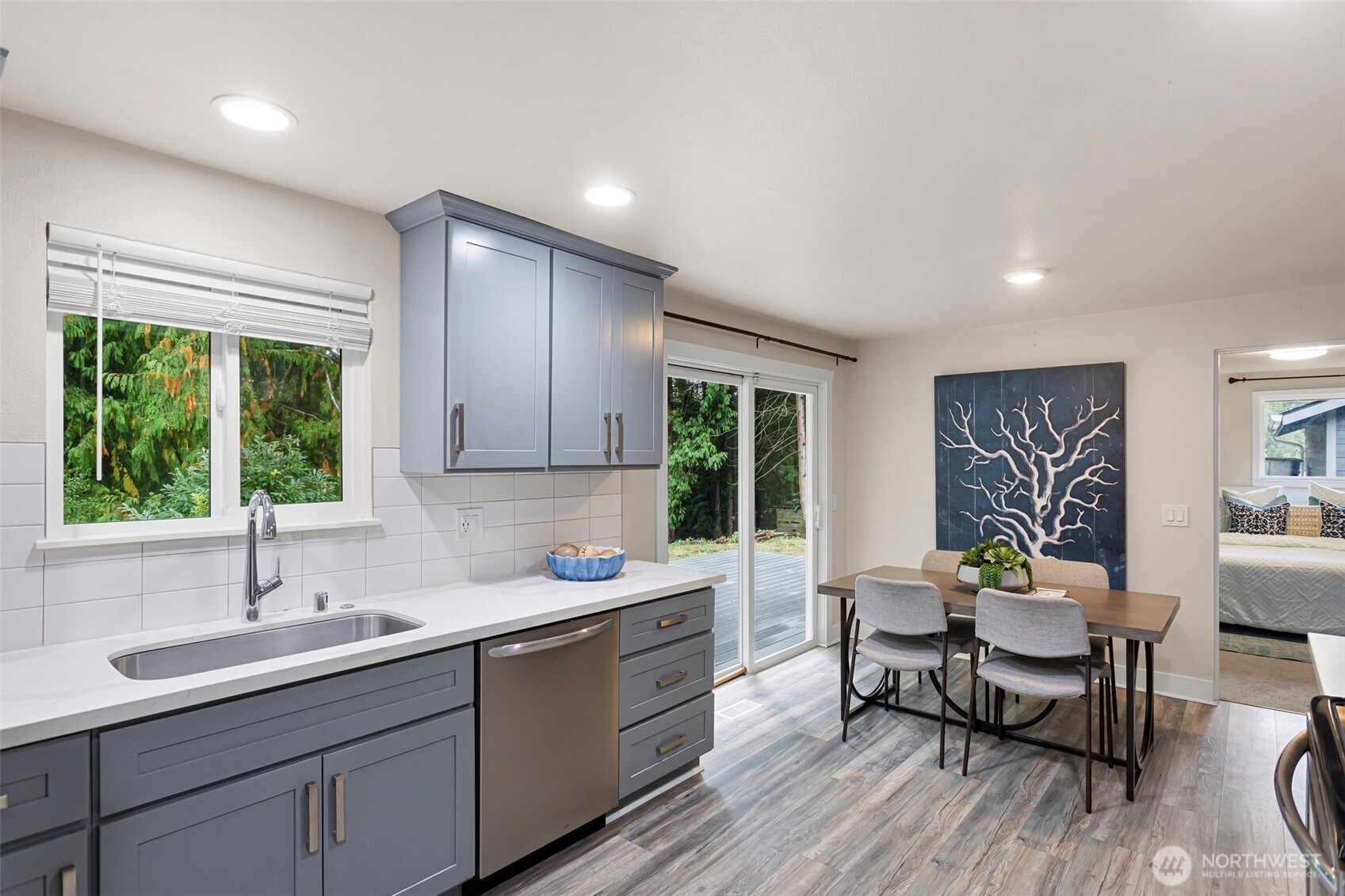 11705 Silver Way Everett, WA 98208 - Photo 10 of 26 a kitchen with a sink cabinets and wooden floor