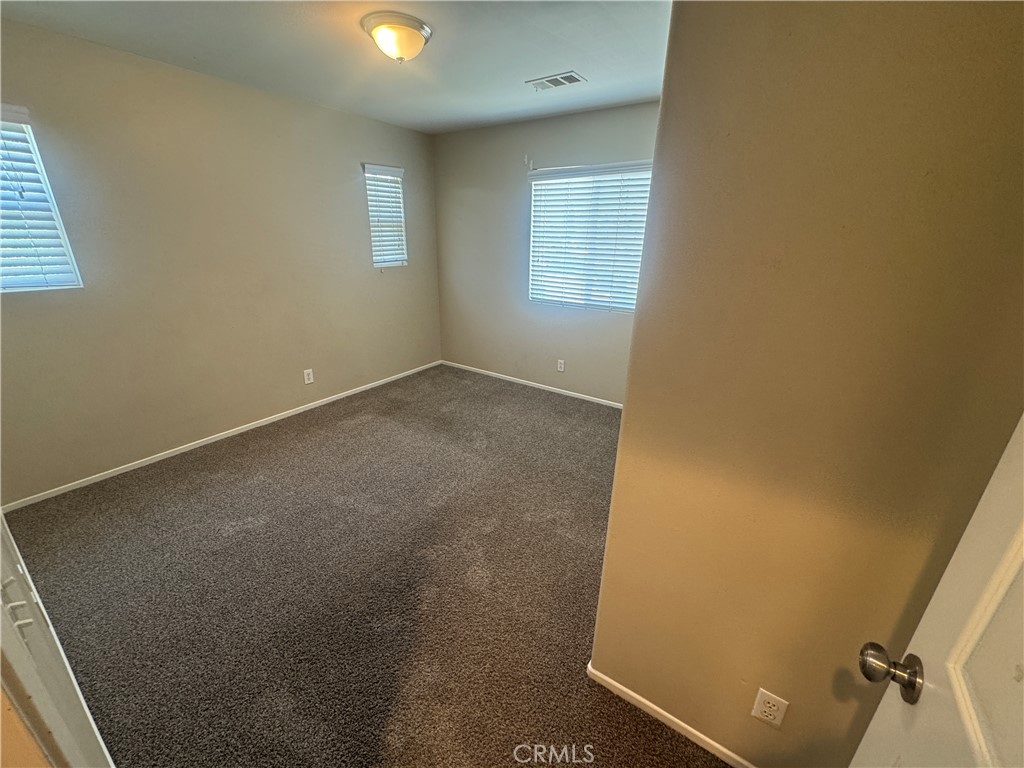 9757 Edenbrook Drive Riverside, CA 92503 - Photo 22 of 40 an empty room with windows