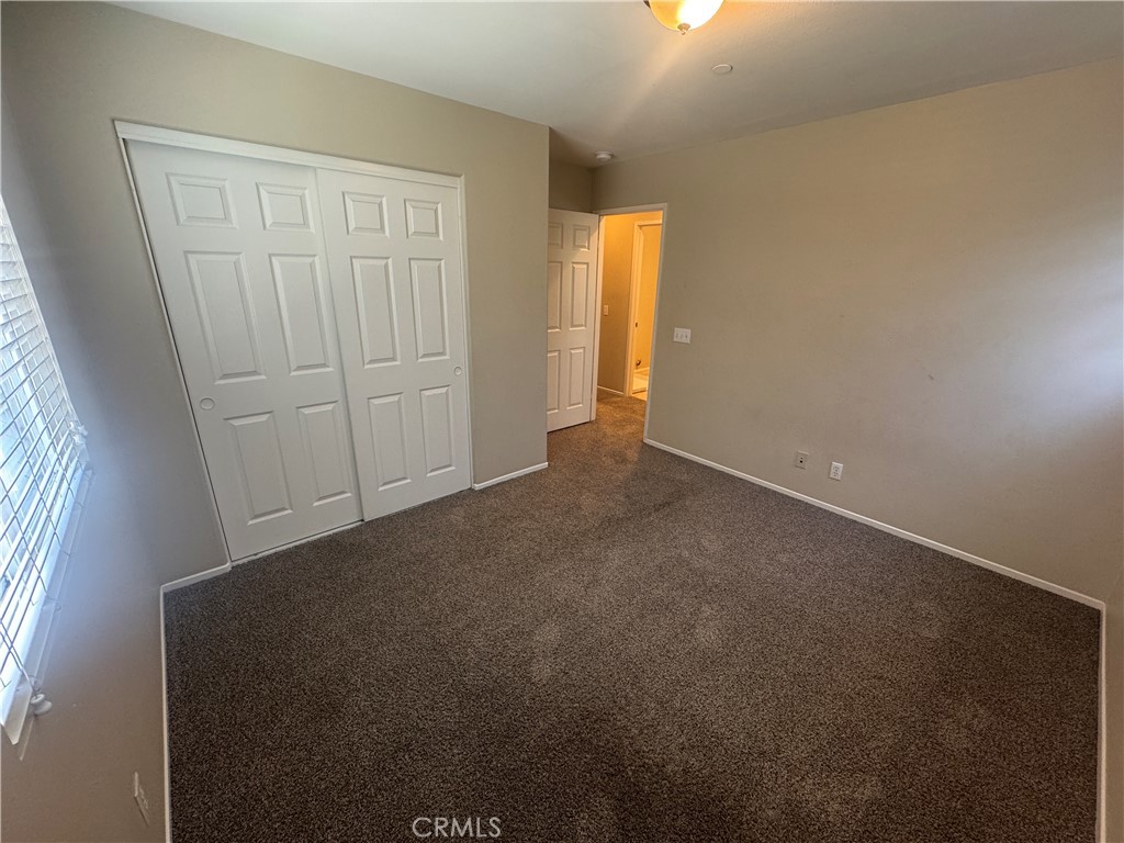 9757 Edenbrook Drive Riverside, CA 92503 - Photo 23 of 40 an empty room with windows