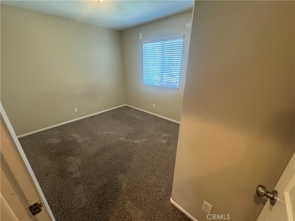 9757 Edenbrook Drive Riverside, CA 92503 - Photo 24 of 40 an empty room with windows