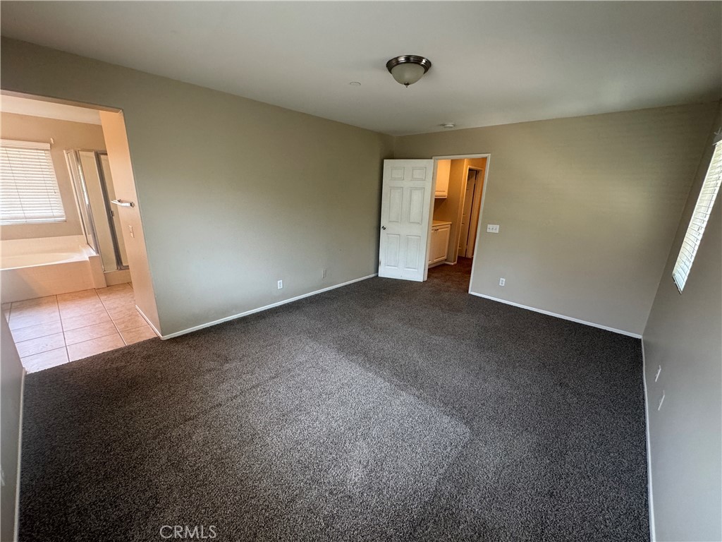 9757 Edenbrook Drive Riverside, CA 92503 - Photo 27 of 40 an empty room with windows