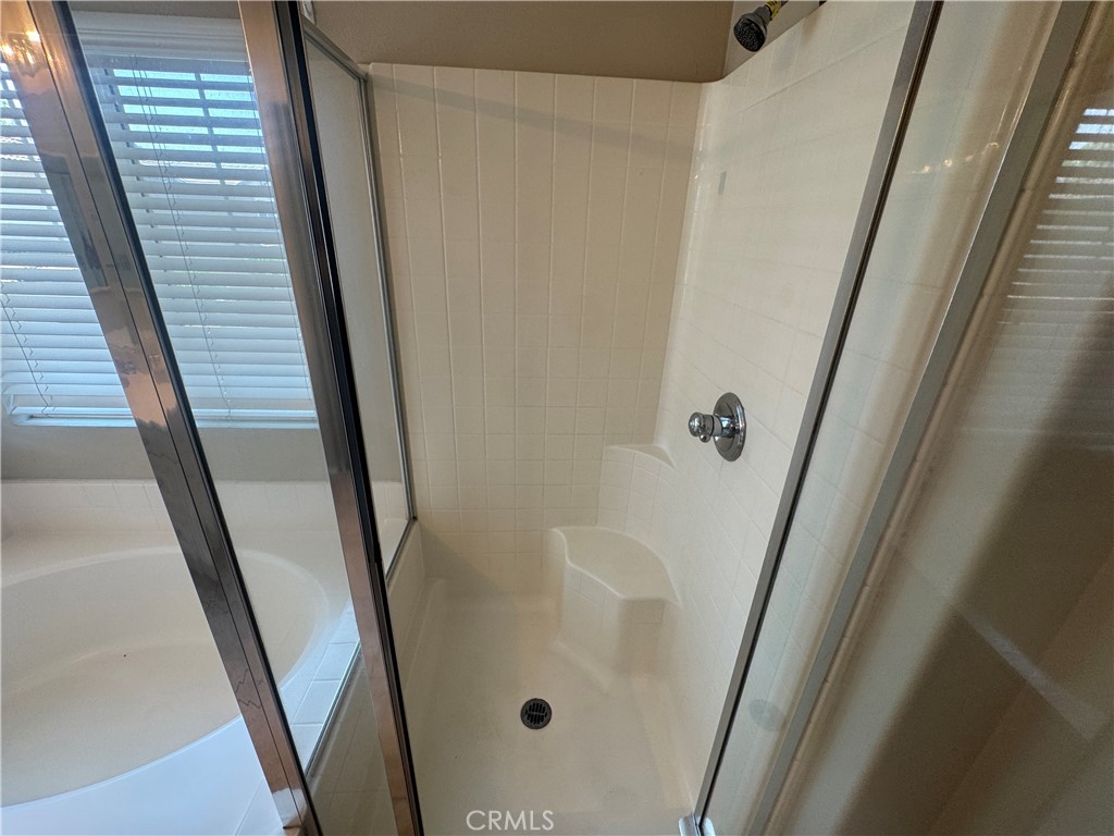 9757 Edenbrook Drive Riverside, CA 92503 - Photo 32 of 40 a bathroom with a shower