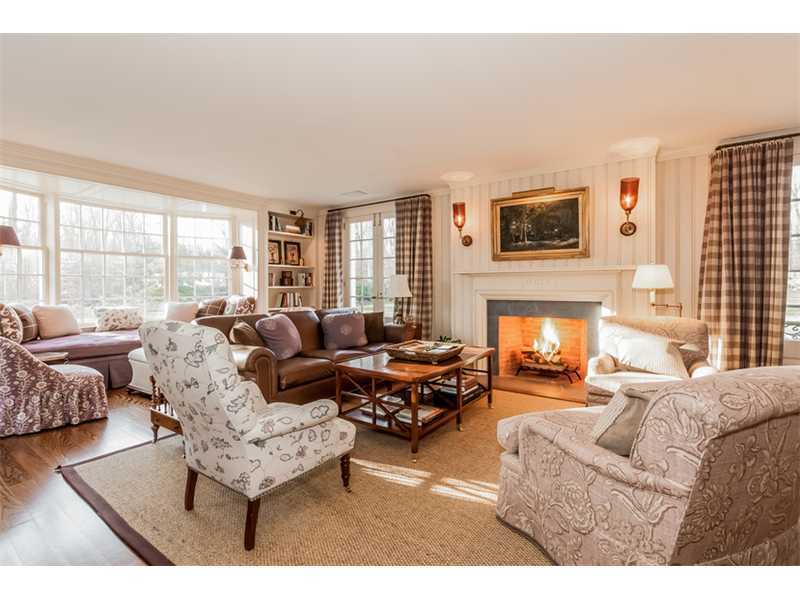 15 Shagbark Road Darien, CT 06820 - Photo 12 of 25 a living room with furniture fireplace and a large window