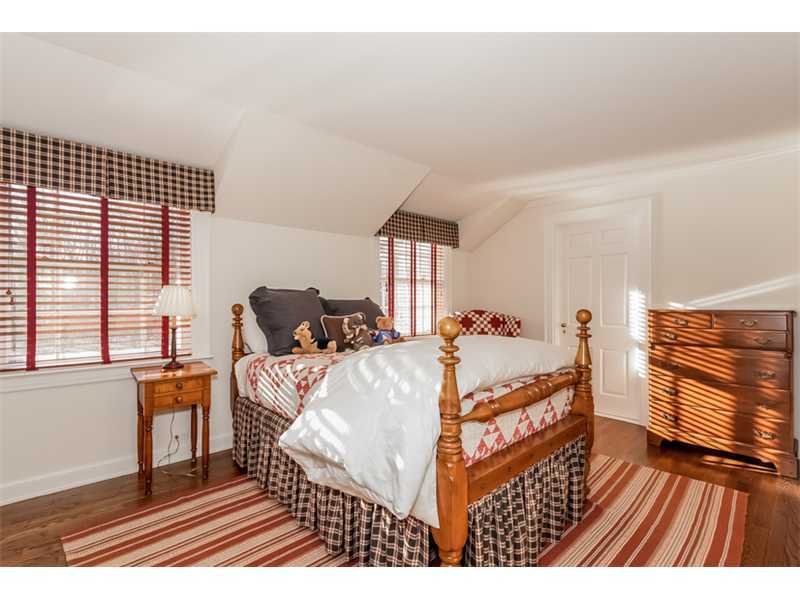 15 Shagbark Road Darien, CT 06820 - Photo 16 of 25 a bed room with a bed and a window