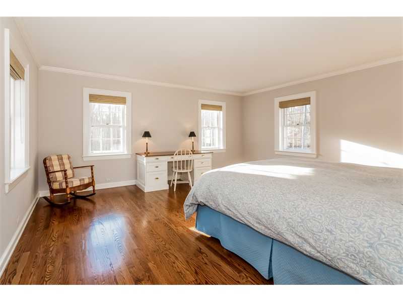 15 Shagbark Road Darien, CT 06820 - Photo 18 of 25 a living room with a bed furniture and a window