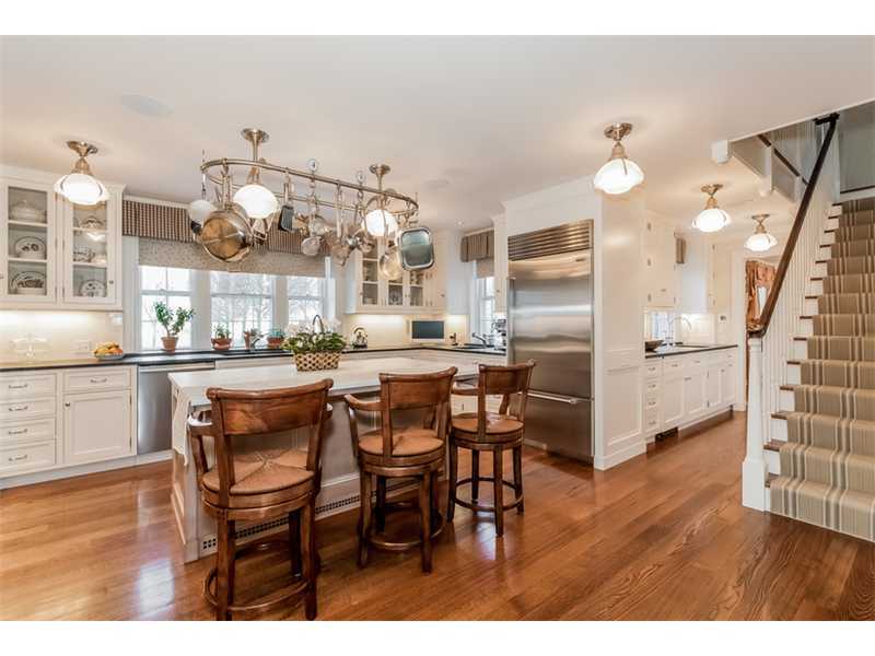 15 Shagbark Road Darien, CT 06820 - Photo 9 of 25 a kitchen with granite countertop a table and chairs in it