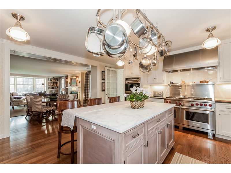 15 Shagbark Road Darien, CT 06820 - Photo 10 of 25 a kitchen with a stove cabinets and wooden floor