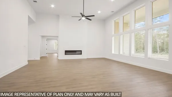 a view of a livingroom with a ceiling fan and window