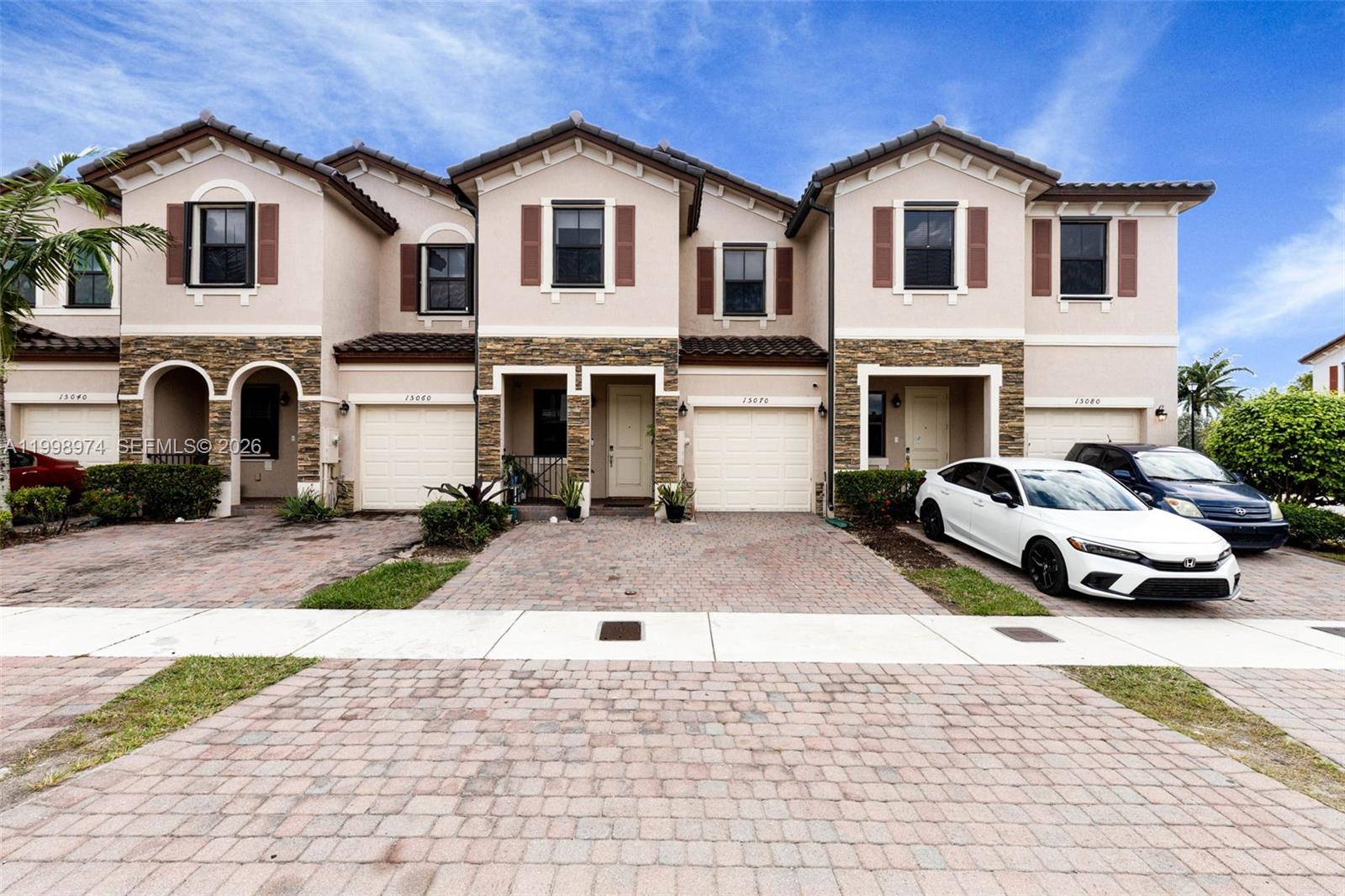 a view of multiple houses with a yard