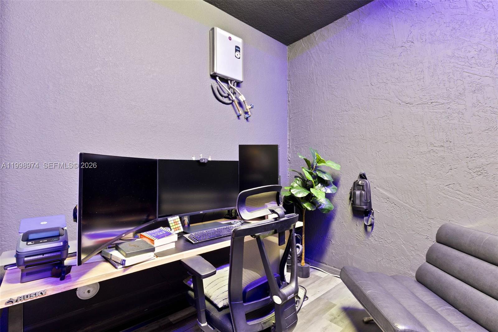 15070 Southwest 119TH Lane Miami, FL 33196 - Photo 14 of 30 a view of a workspace with furniture