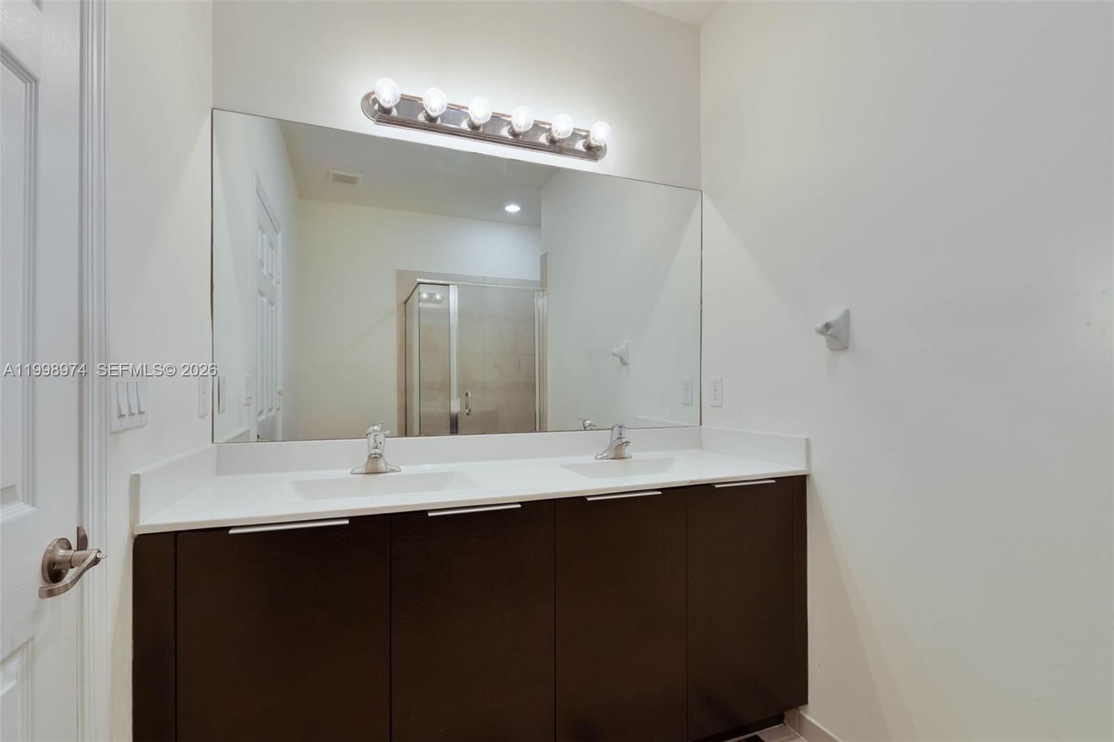 15070 Southwest 119TH Lane Miami, FL 33196 - Photo 20 of 30 a close up of a sink and a mirror