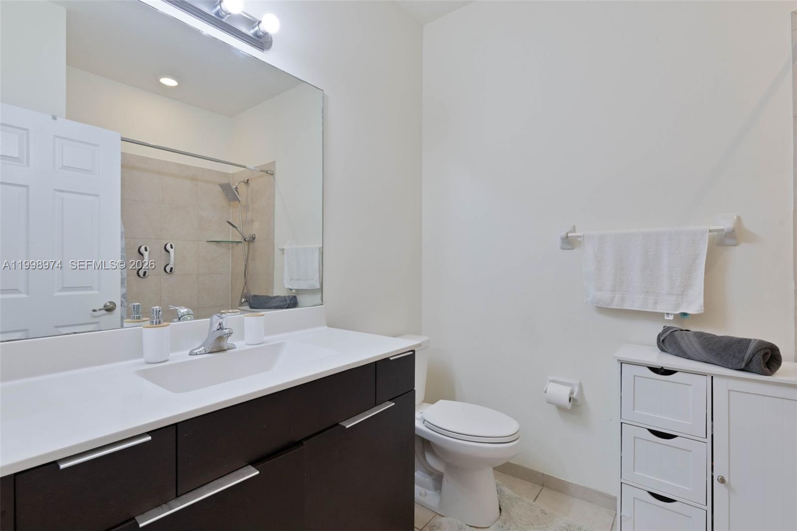 15070 Southwest 119TH Lane Miami, FL 33196 - Photo 22 of 30 a bathroom with a sink toilet and vanity
