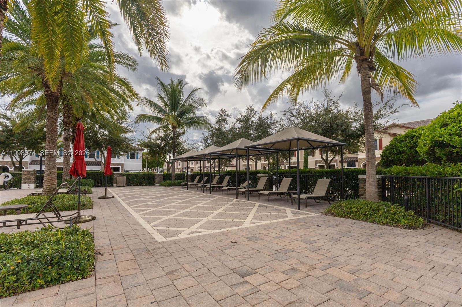 15070 Southwest 119TH Lane Miami, FL 33196 - Photo 30 of 30 a view of a yard with a slide and a patio