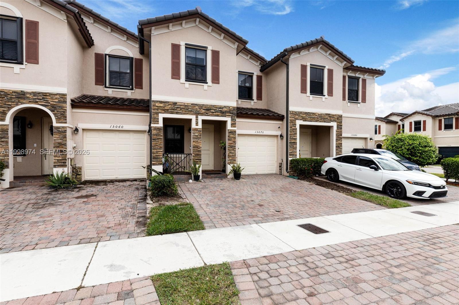 15070 Southwest 119TH Lane Miami, FL 33196 - Photo 3 of 30 a view of multiple houses with a yard