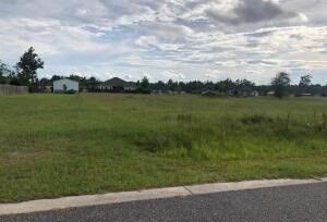 a view of a lake with a yard