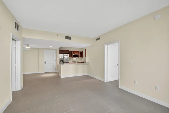 a view of a room with cabinet and a flat screen tv