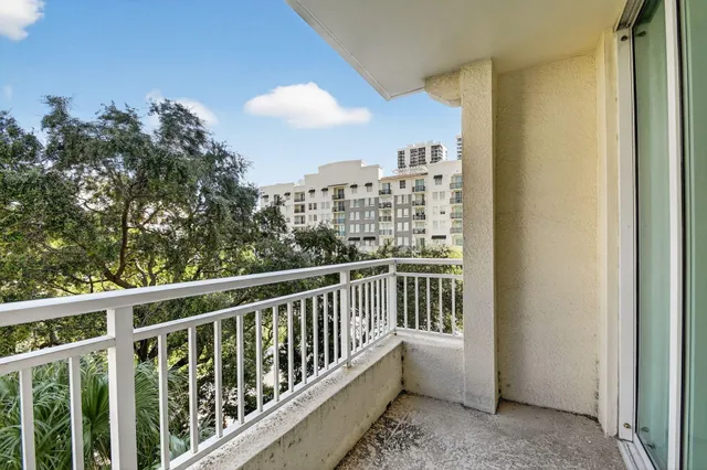 a view of balcony with a floor to ceiling window and wooden floor