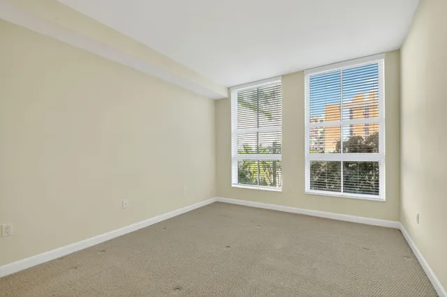 a bathroom with a double vanity sink toilet mirror and bathtub