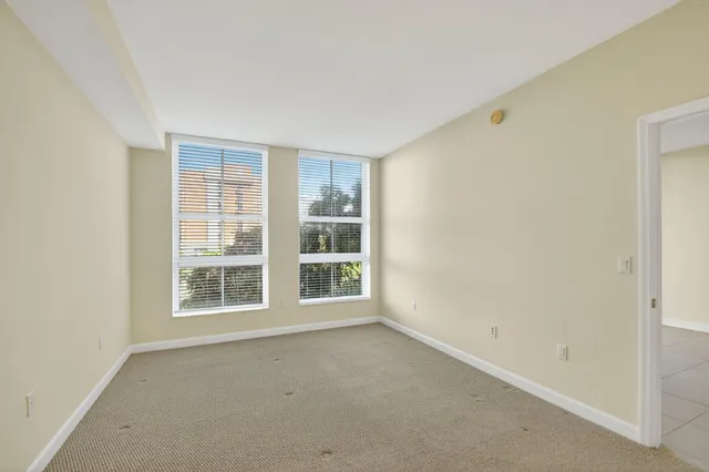 a bathroom with a double vanity sink toilet and a bathtub
