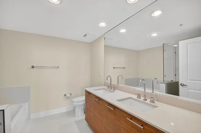 a bathroom with a sink a toilet and a bathtub