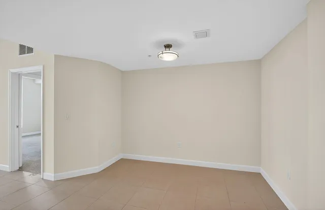 an empty room with a empty space and window