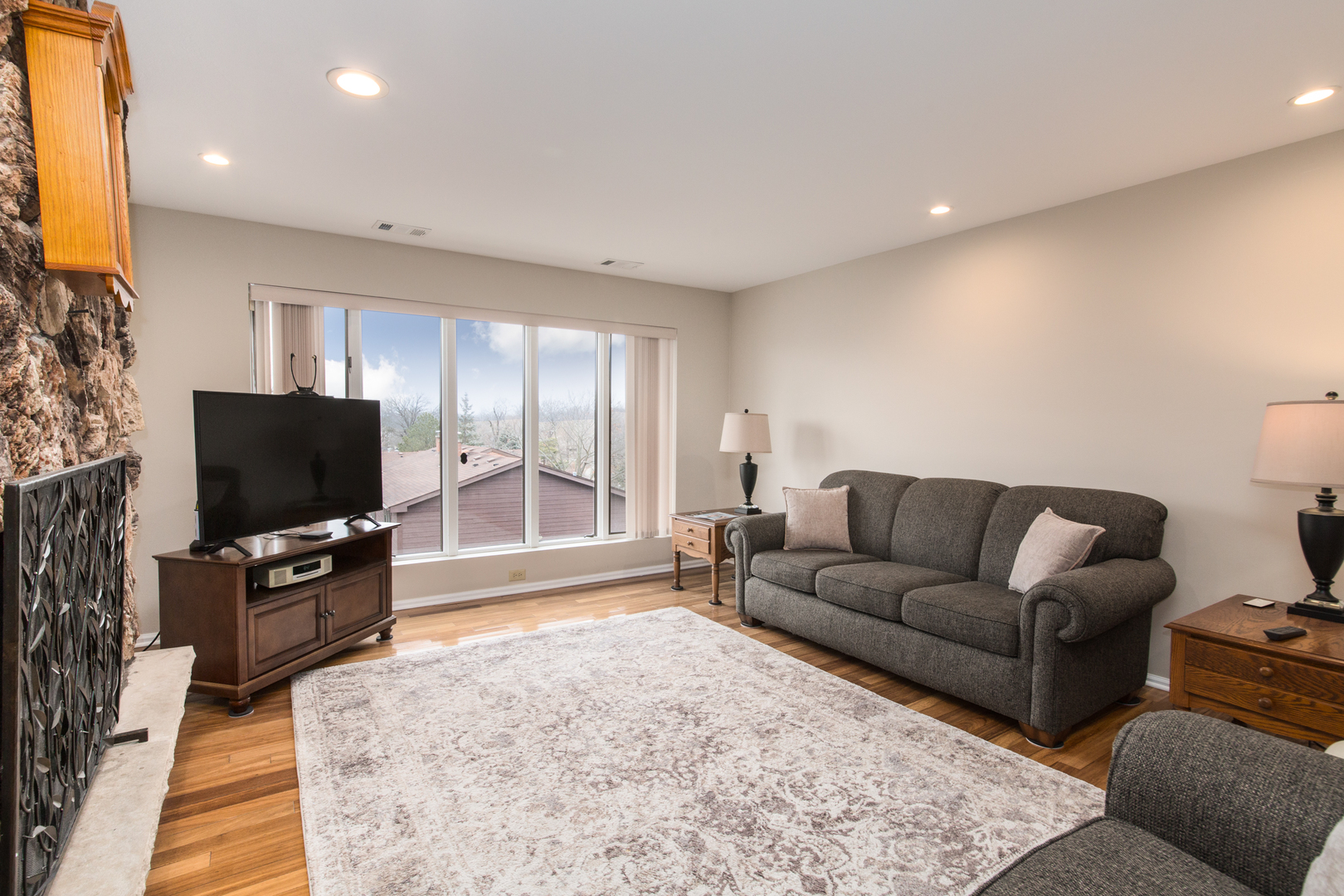 175 Boardwalk Place, Unit 301 Park Ridge, IL 60068 - Photo 3 of 20 a living room with furniture and a flat screen tv