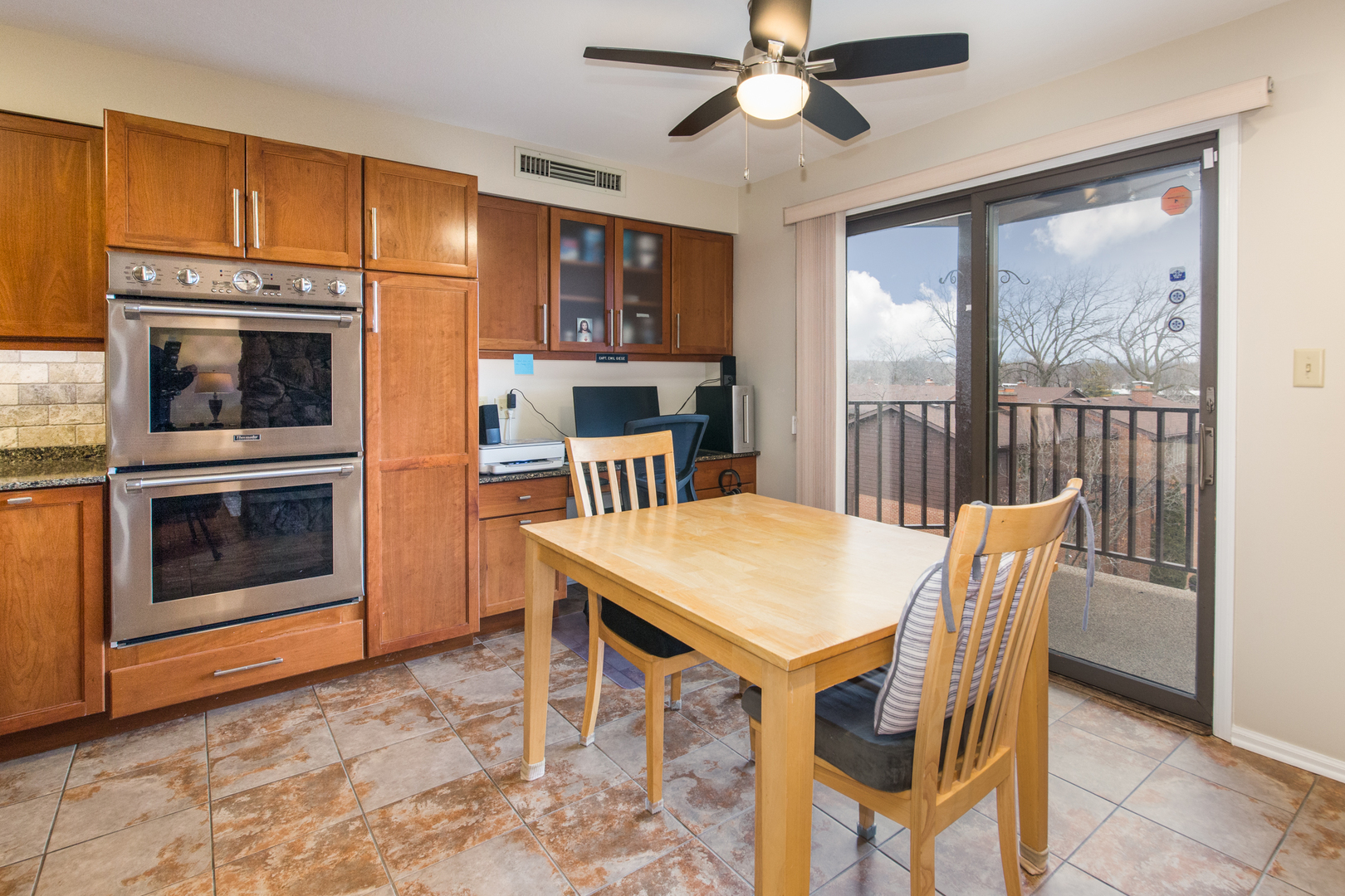 175 Boardwalk Place, Unit 301 Park Ridge, IL 60068 - Photo 5 of 20 a view of a dining room with furniture window and wooden floor