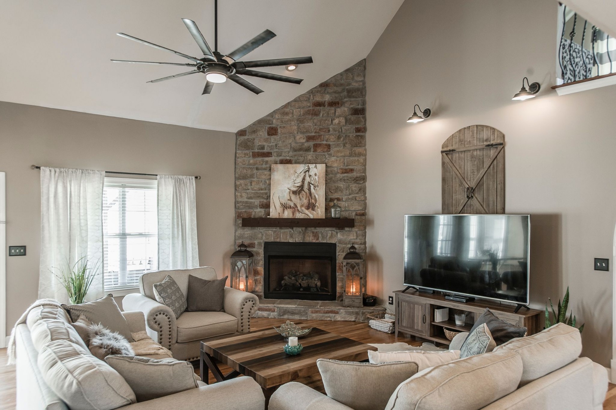 1351 Pee Dee Branch Road Cottontown, TN 37048 - Photo 18 of 59 a living room with furniture a flat screen tv and a fireplace