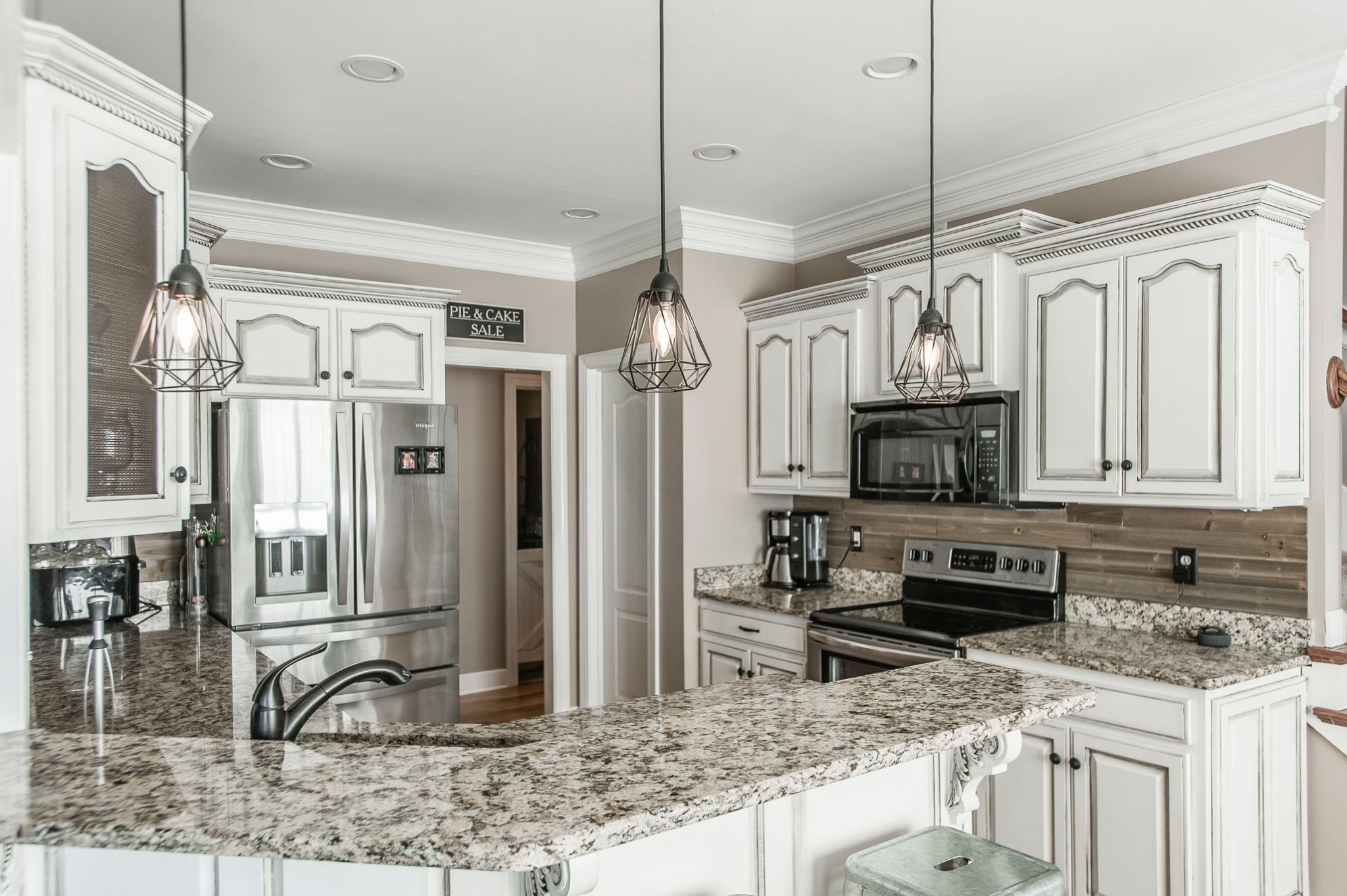 1351 Pee Dee Branch Road Cottontown, TN 37048 - Photo 25 of 59 a kitchen with stainless steel appliances granite countertop a sink a stove top oven a refrigerator with granite countertops and cabinets