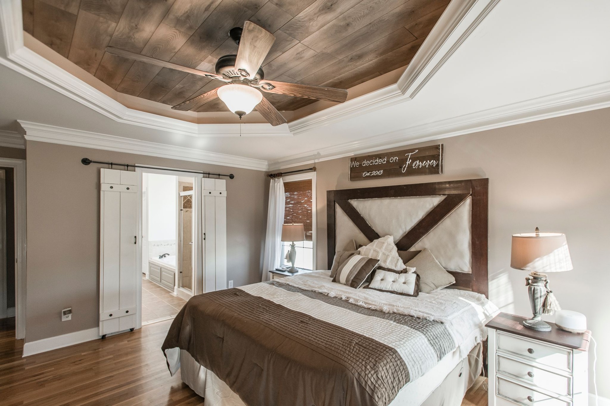1351 Pee Dee Branch Road Cottontown, TN 37048 - Photo 31 of 59 a bedroom with a bed and a chandelier