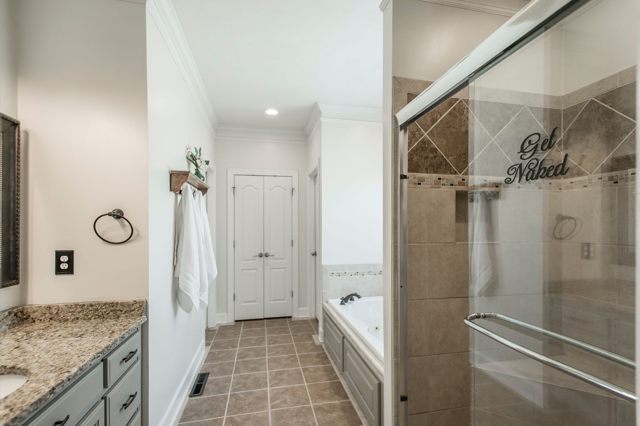 1351 Pee Dee Branch Road Cottontown, TN 37048 - Photo 35 of 59 a bathroom with a granite countertop shower mirror and a sink