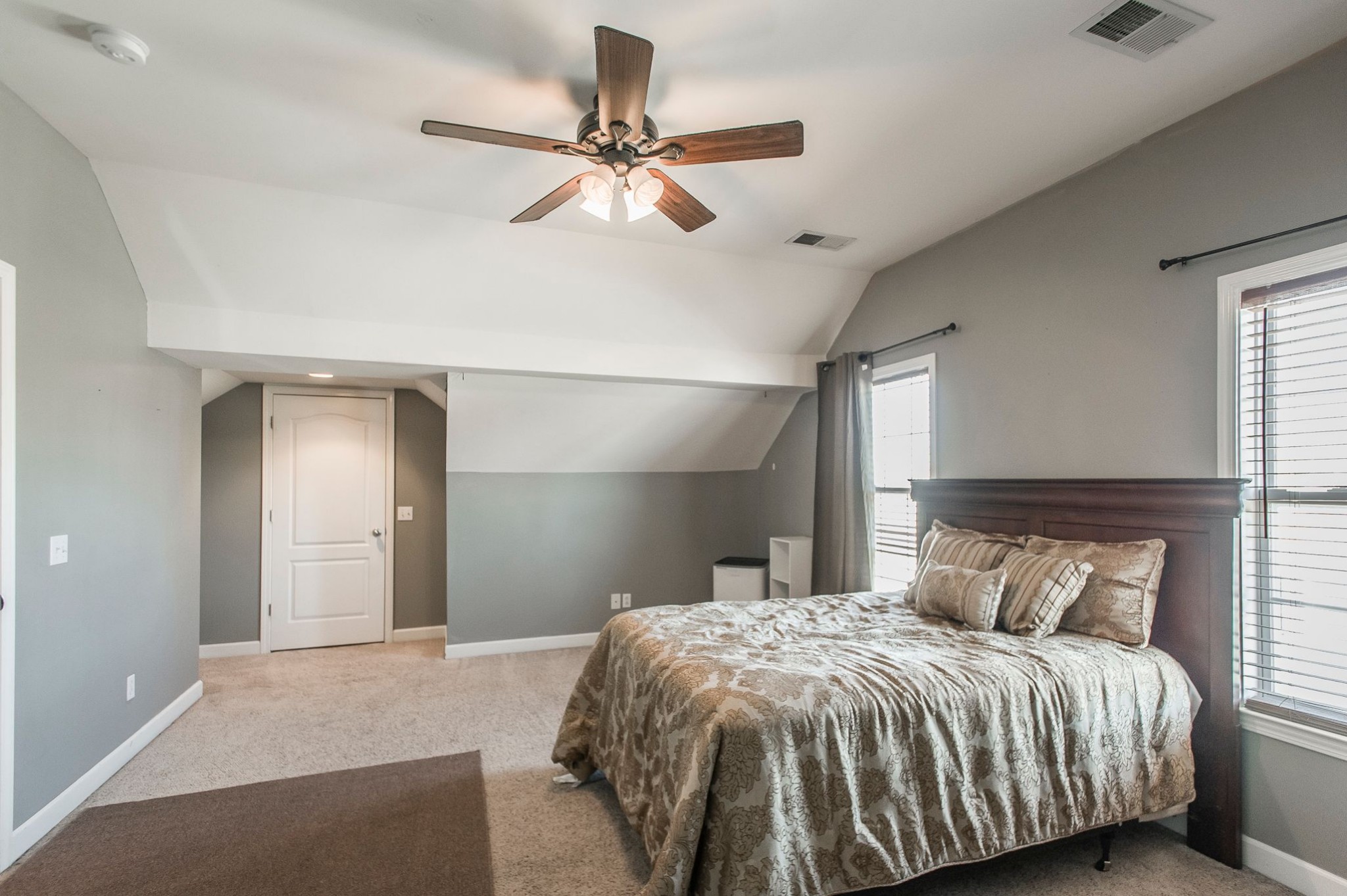 1351 Pee Dee Branch Road Cottontown, TN 37048 - Photo 45 of 59 a bedroom with a bed and a chandelier