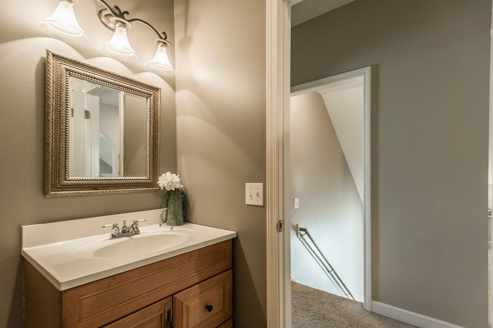1351 Pee Dee Branch Road Cottontown, TN 37048 - Photo 47 of 59 a bathroom with a sink and mirror with toilet