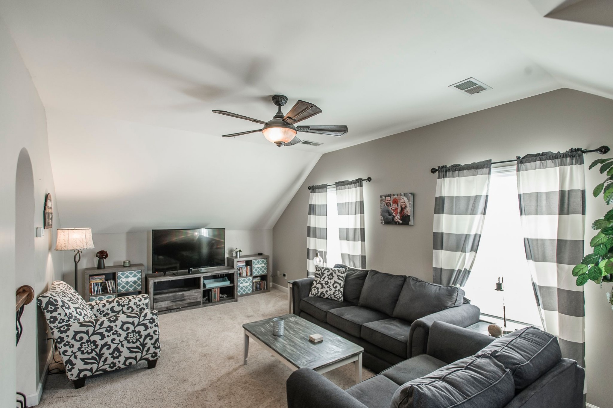 1351 Pee Dee Branch Road Cottontown, TN 37048 - Photo 50 of 59 a living room with furniture a flat screen tv and a window