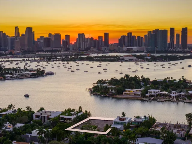 a front view of multiple houses with yard