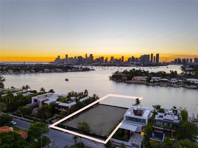 a front view of multiple houses with yard