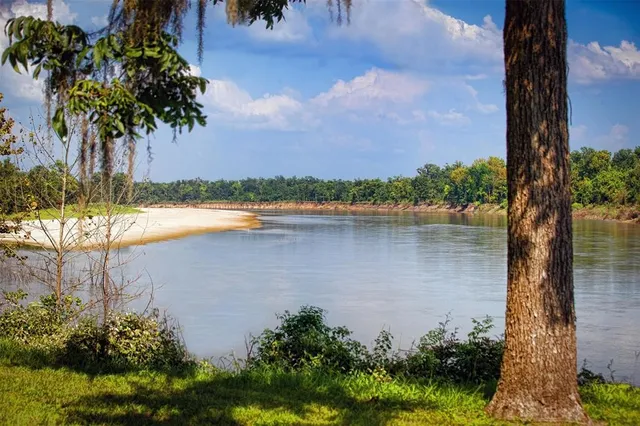 a view of lake with green space