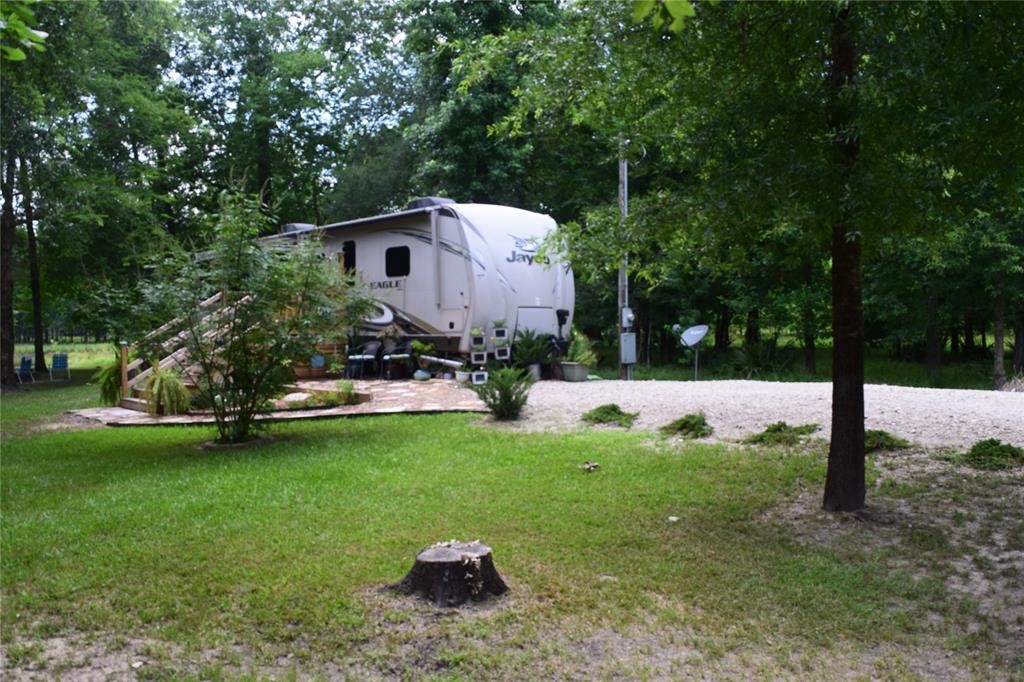 478 Center Drive Cleveland, TX 77327 - Photo 28 of 33 a view of a backyard with sitting area