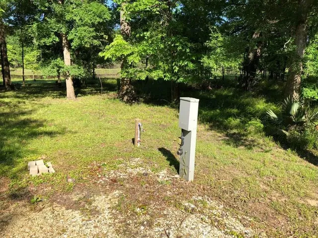 a sign board with river in front of it