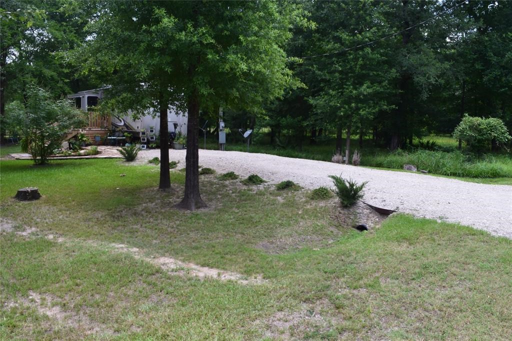 478 Center Drive Cleveland, TX 77327 - Photo 10 of 33 a view of a tree in a yard