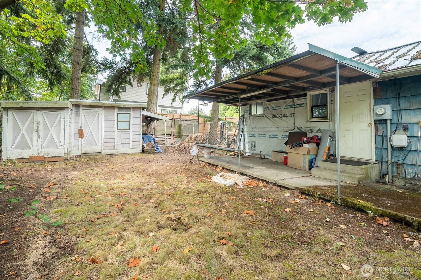 1147 Aberdeen Avenue Northeast Renton, WA 98056 - Photo 13 of 24 a backyard of a house with barbeque oven table and chairs