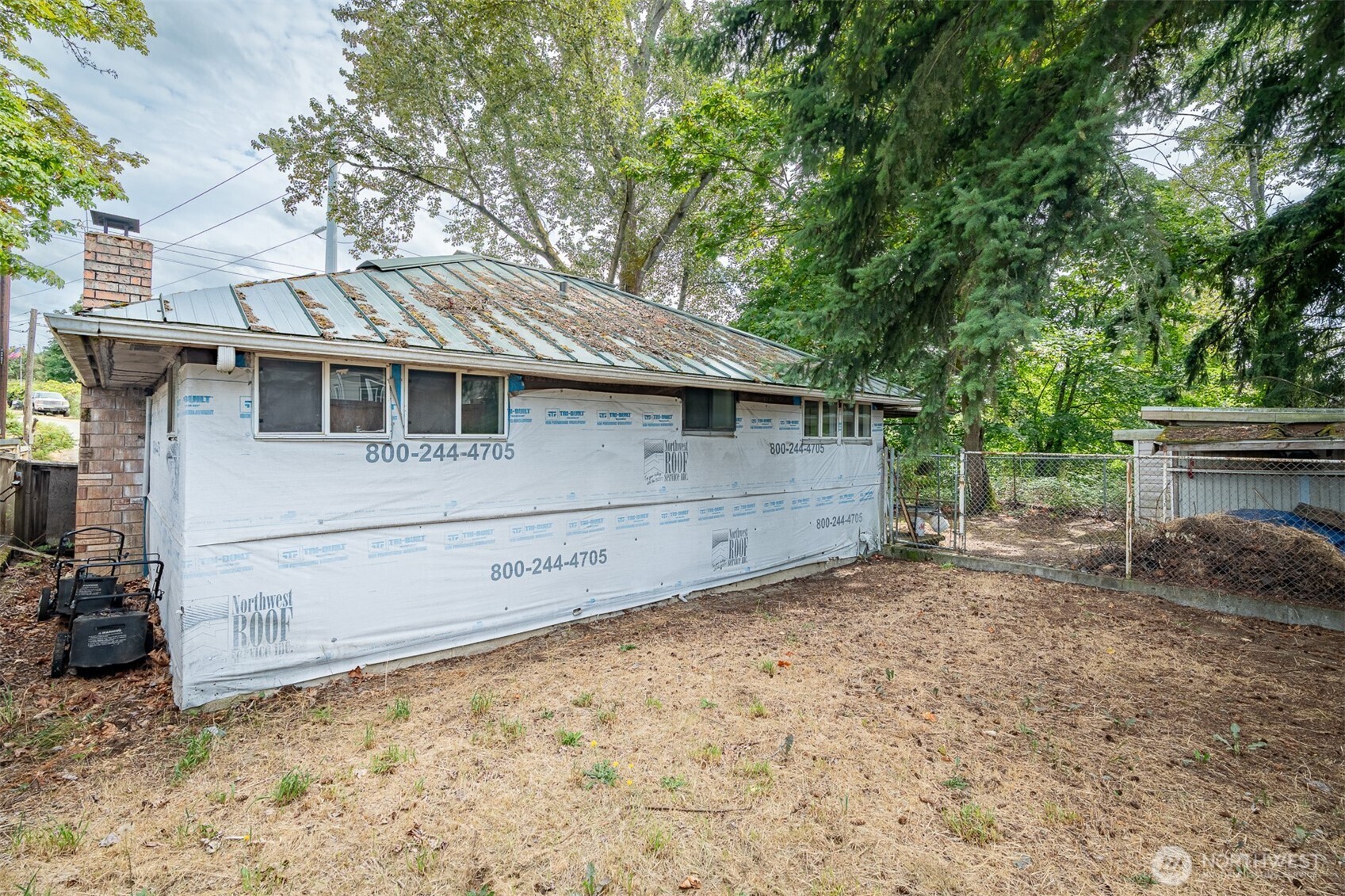 1147 Aberdeen Avenue Northeast Renton, WA 98056 - Photo 16 of 24 a view of a white house with large trees