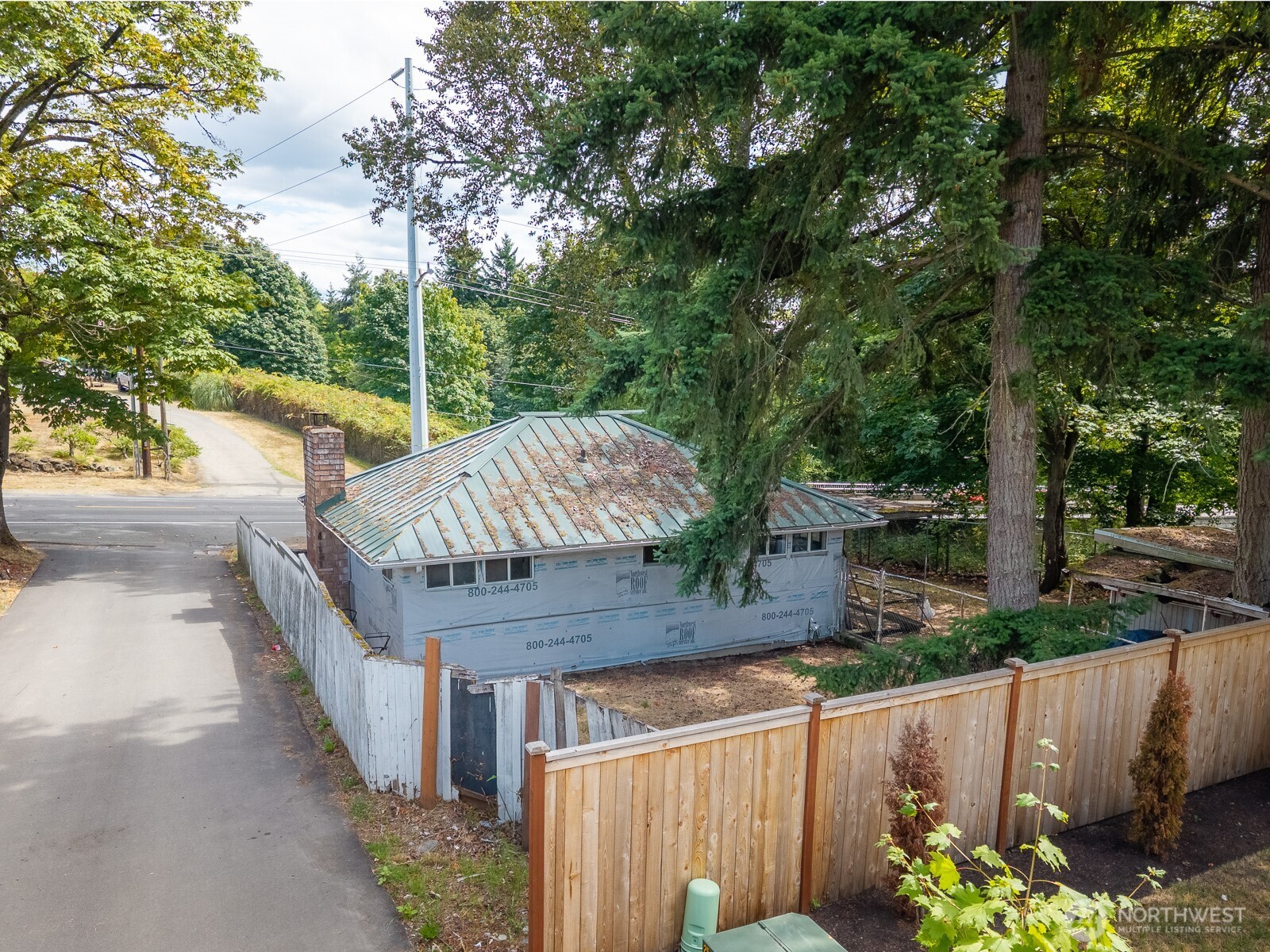 1147 Aberdeen Avenue Northeast Renton, WA 98056 - Photo 19 of 24 a view of a wooden fence and trees