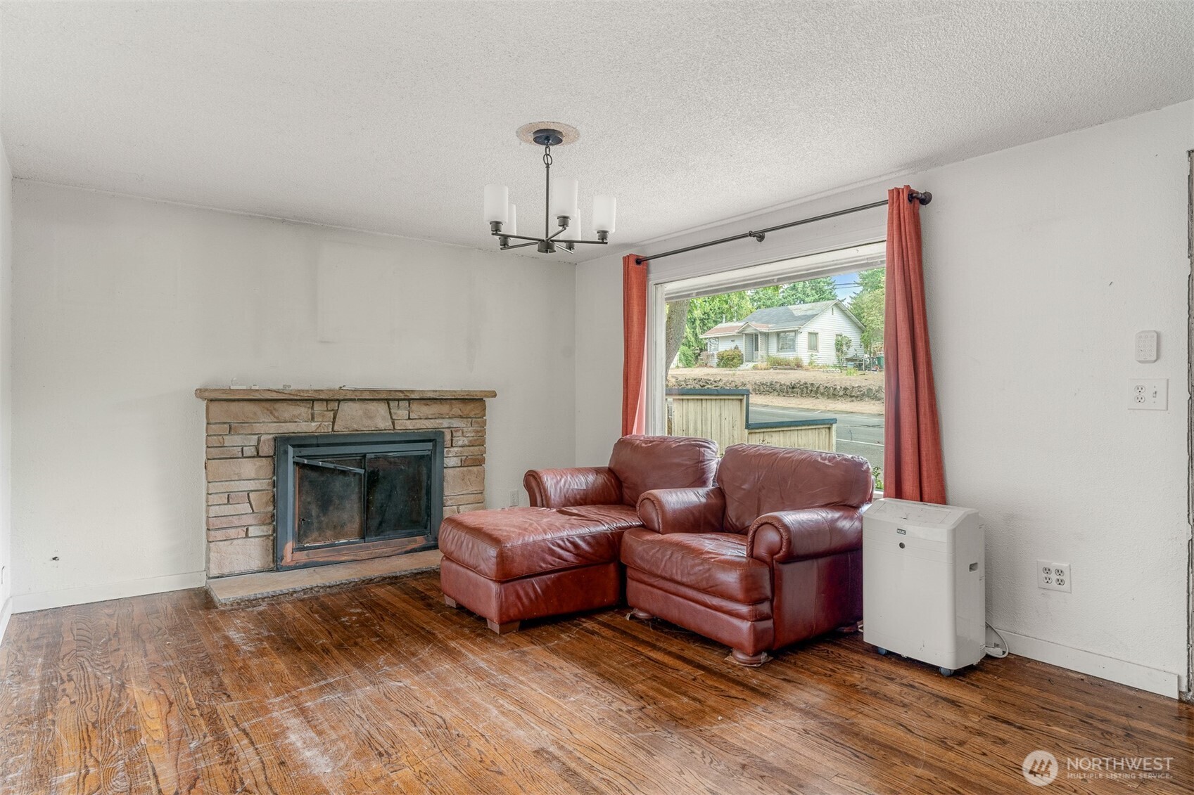 1147 Aberdeen Avenue Northeast Renton, WA 98056 - Photo 2 of 24 a living room with furniture and a fireplace