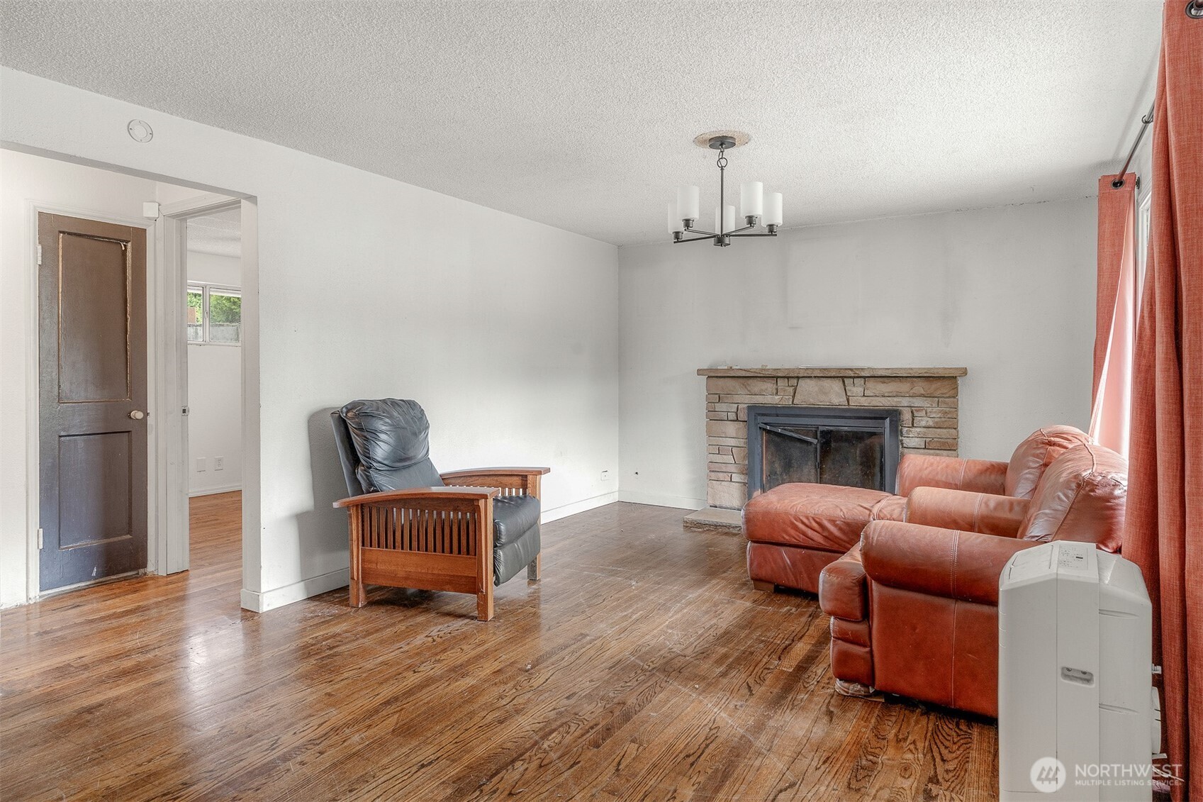 1147 Aberdeen Avenue Northeast Renton, WA 98056 - Photo 3 of 24 a living room with furniture and a fireplace