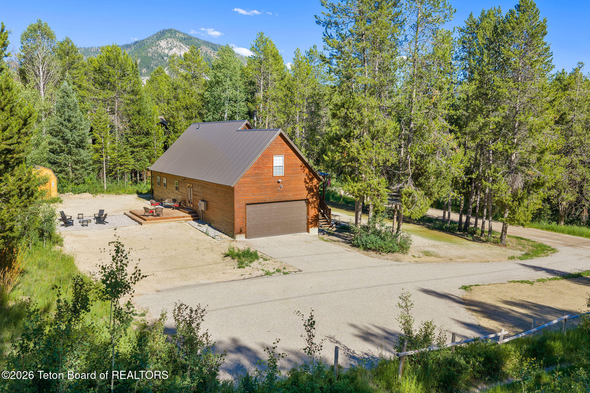 9 Pine Street Alpine, WY 83128 - Photo 9 of 78 Driveway and Backyard