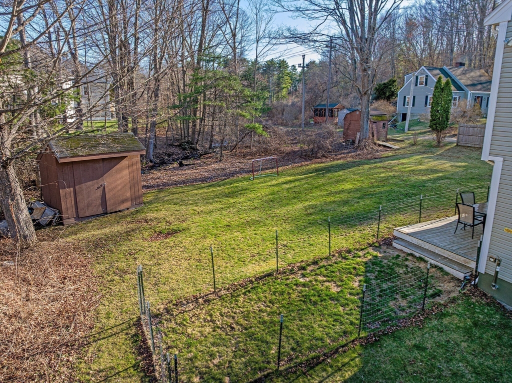 38 Brook Street Georgetown, MA 01833 - Photo 33 of 42 a view of a backyard with large tree
