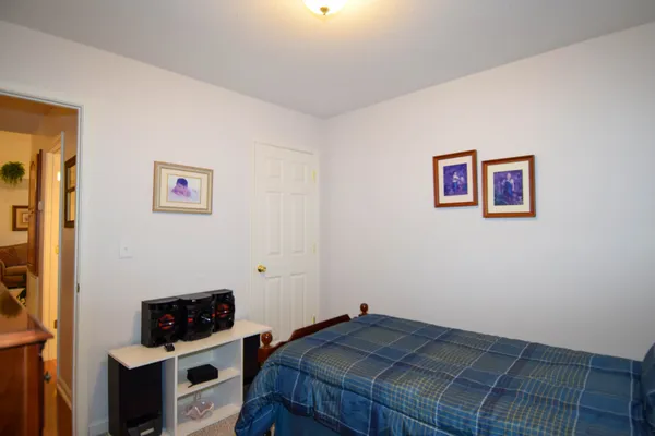 a bedroom with a bed and cabinets