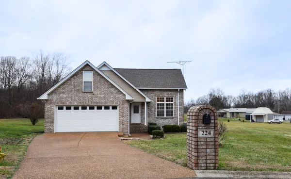 front view of a house with a yard